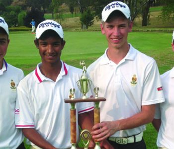 Junior golfers sharing a championship moment