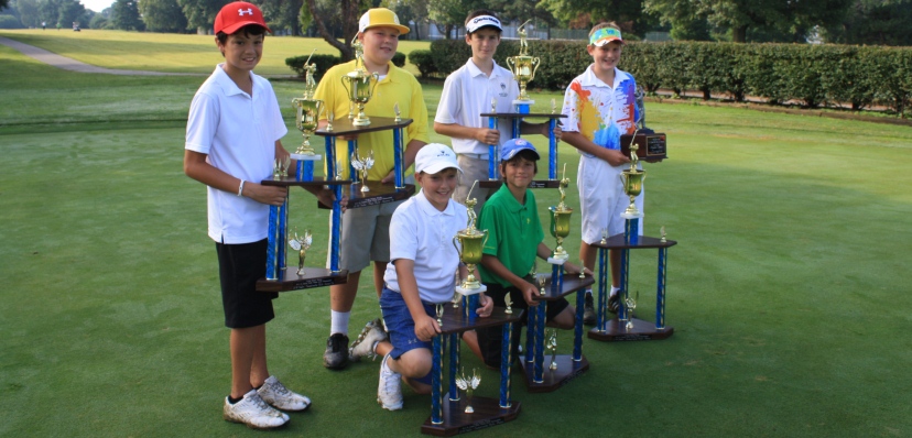 Junior golfers with Trophies